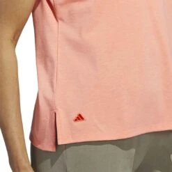 Adidas 2023 Women's Go-To Heathered Polo 10 Adidas 2023 Women's Go-To Heathered Polo -Callaway Store adidas 23 womens go to heathered polo coral fusion detail2 itempicture